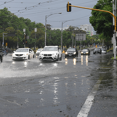 Cars driving through rainwater